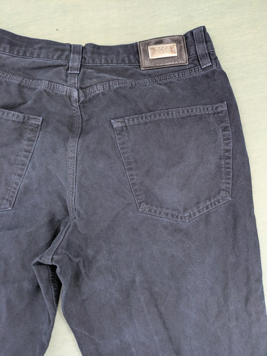 BOSS Hugo Boss grey straight jeans classic 5-pocket design with leather patch.