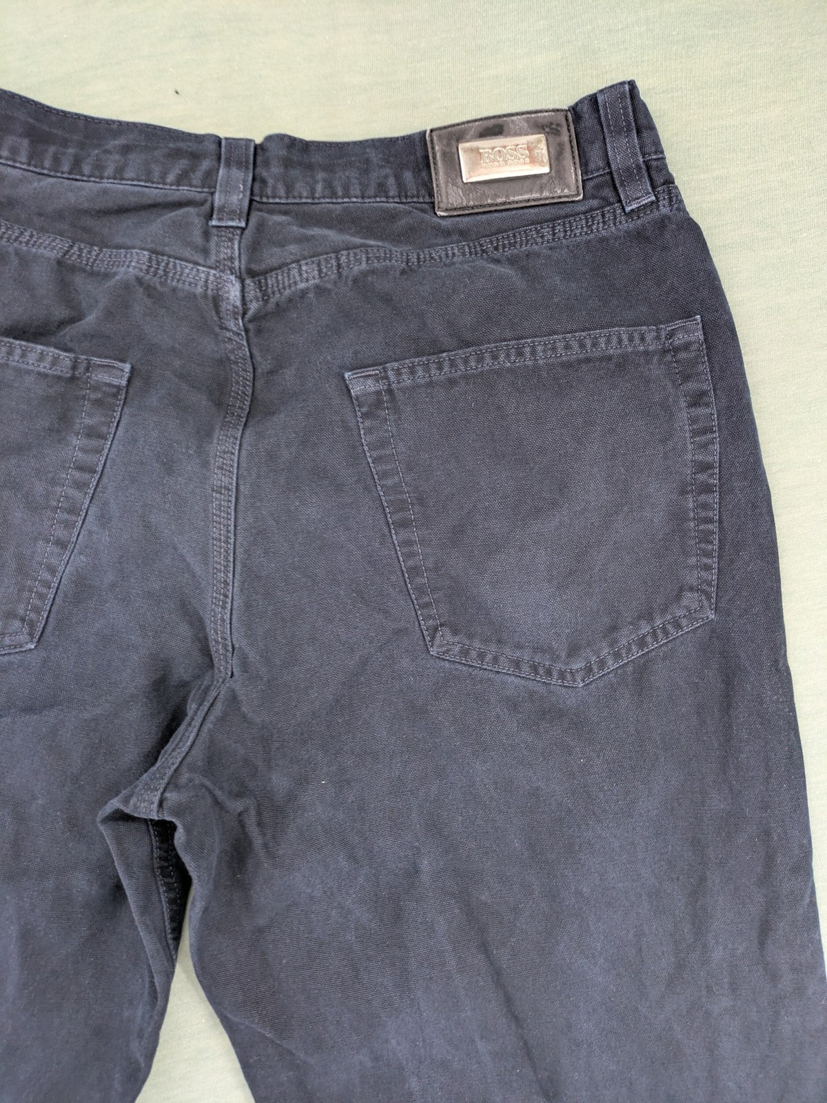 BOSS Hugo Boss grey straight jeans classic 5-pocket design with leather patch.