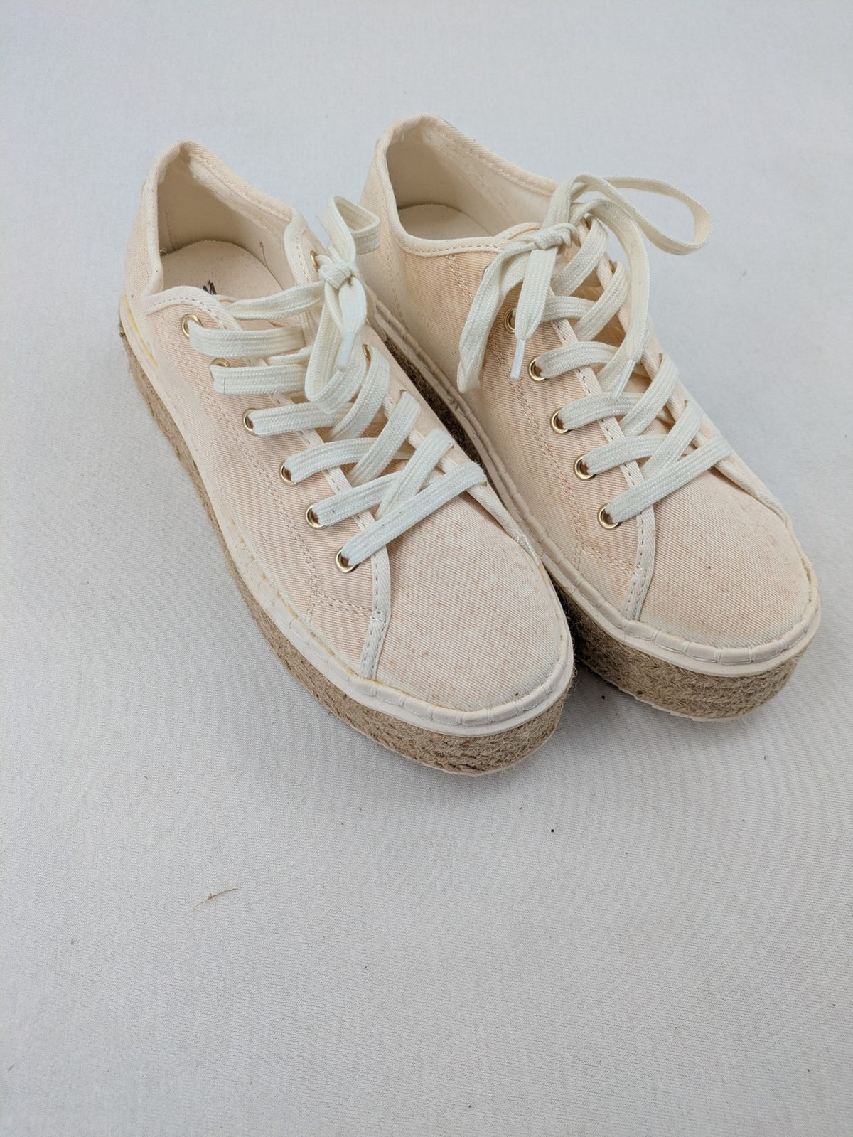 H&M beige espadrille sneakers with jute sole and cream canvas upper.