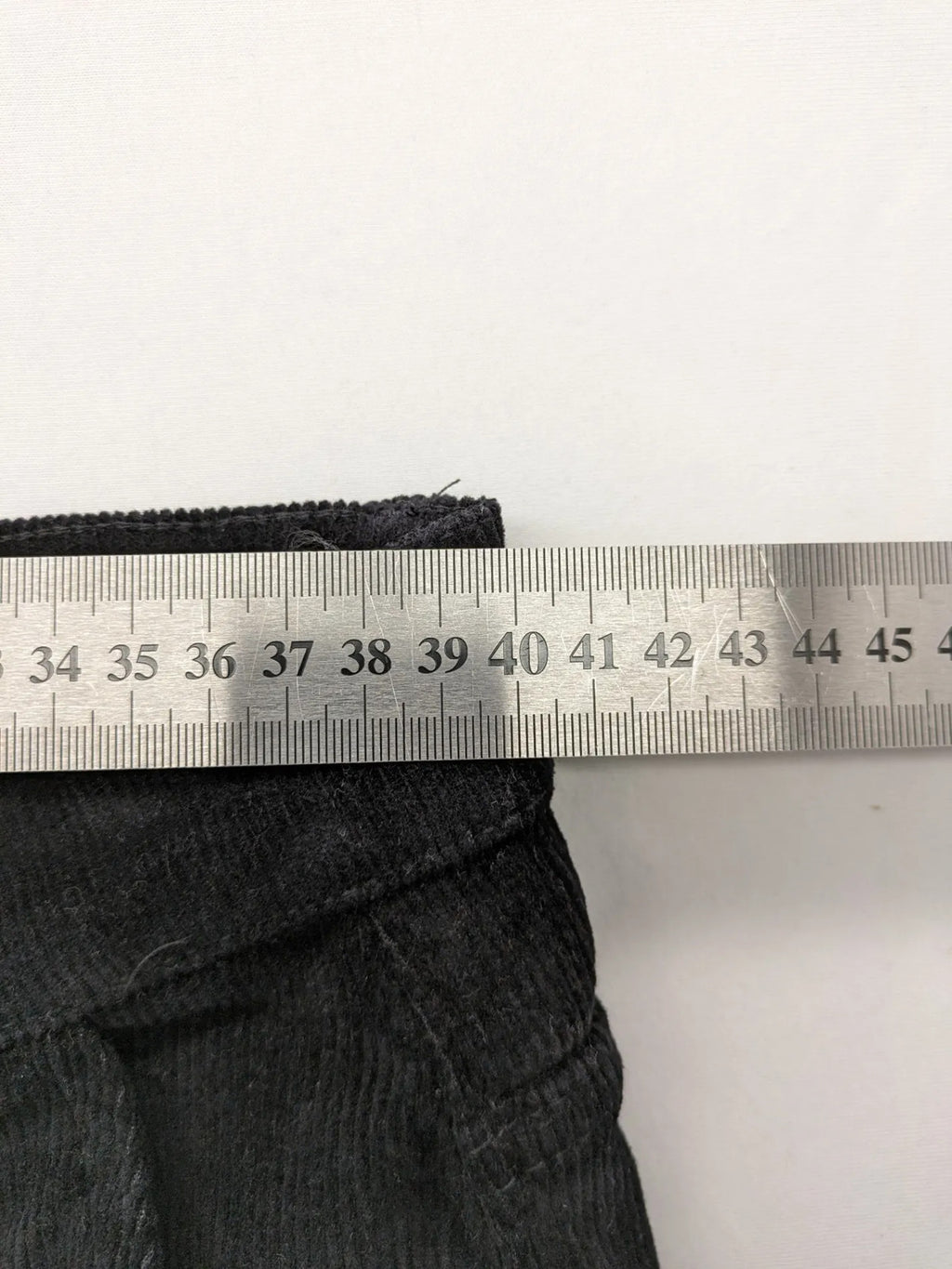 Tomfear black straight fit cord jeans, classic five-pocket design, soft corduroy material.