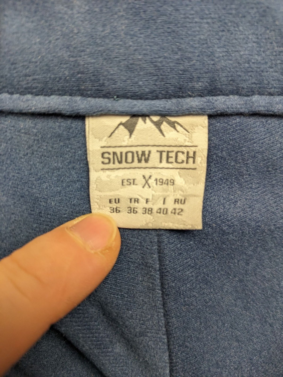 Snow Tech blue ski pants with modern denim look and durable polyester material.