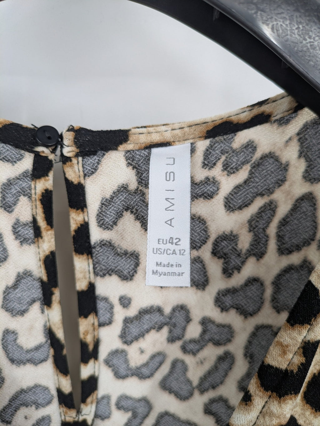 Amisu beige jumpsuit leopard print V-neck, short sleeves, keyhole back detail.