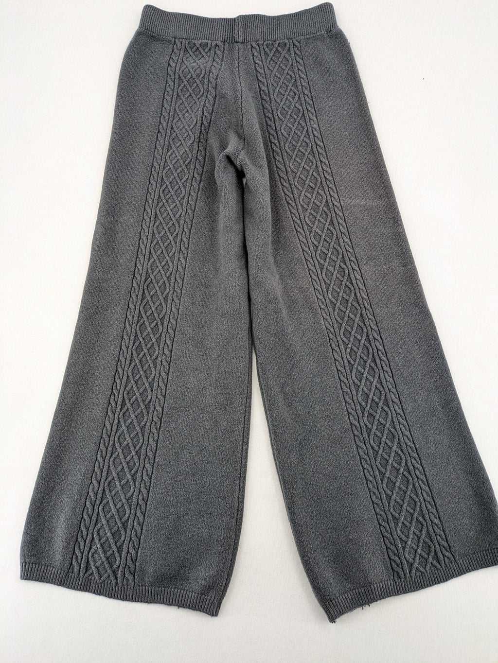 Grey pants with cable knit pattern, wide leg, ribbed waistband, 100% polyester.
