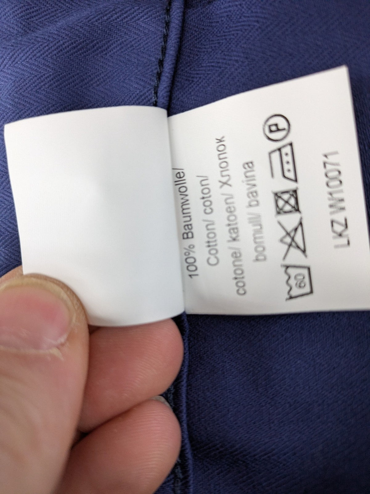 Uvex navy work trousers 100% cotton with button closure and belt loops.