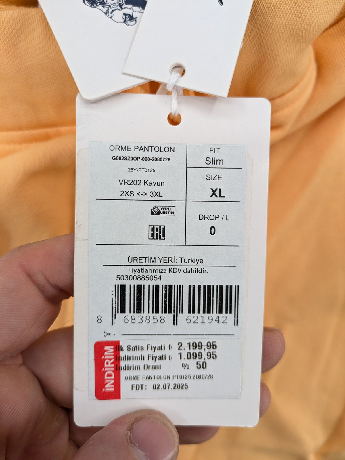 U.S. Polo Assn. orange sweatpants slim fit with sequin USPA logo on leg.