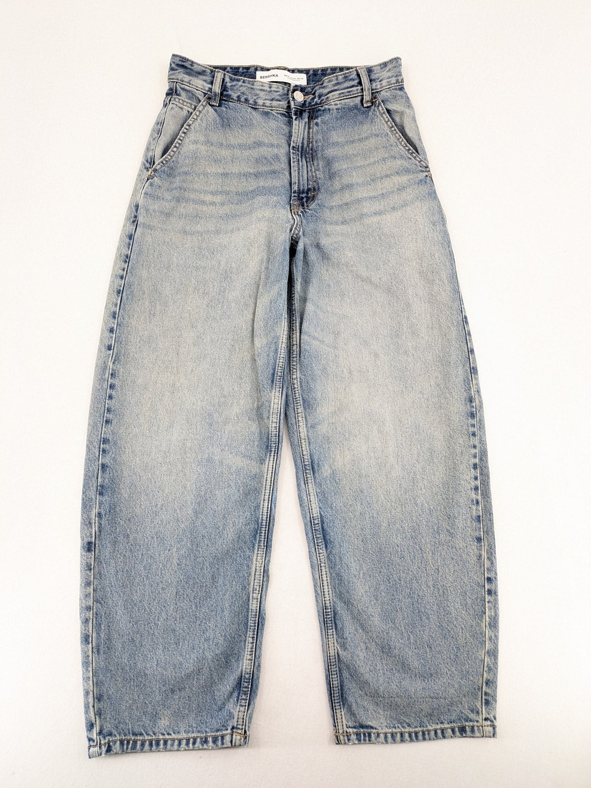 Bershka blue wide leg jeans high waist baggy style with light wash and cotton material.