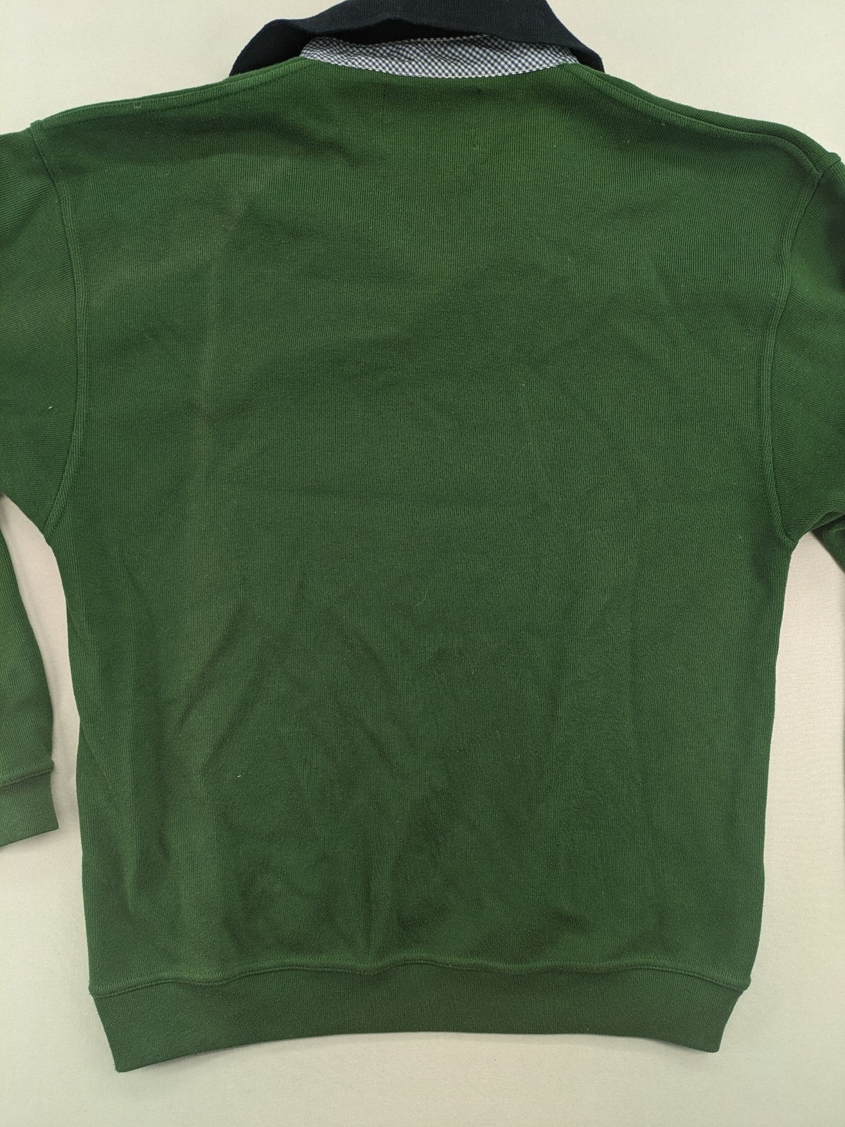 Headlands green turtle neck jumper with gingham collar and "Golden Beach" embroidery.