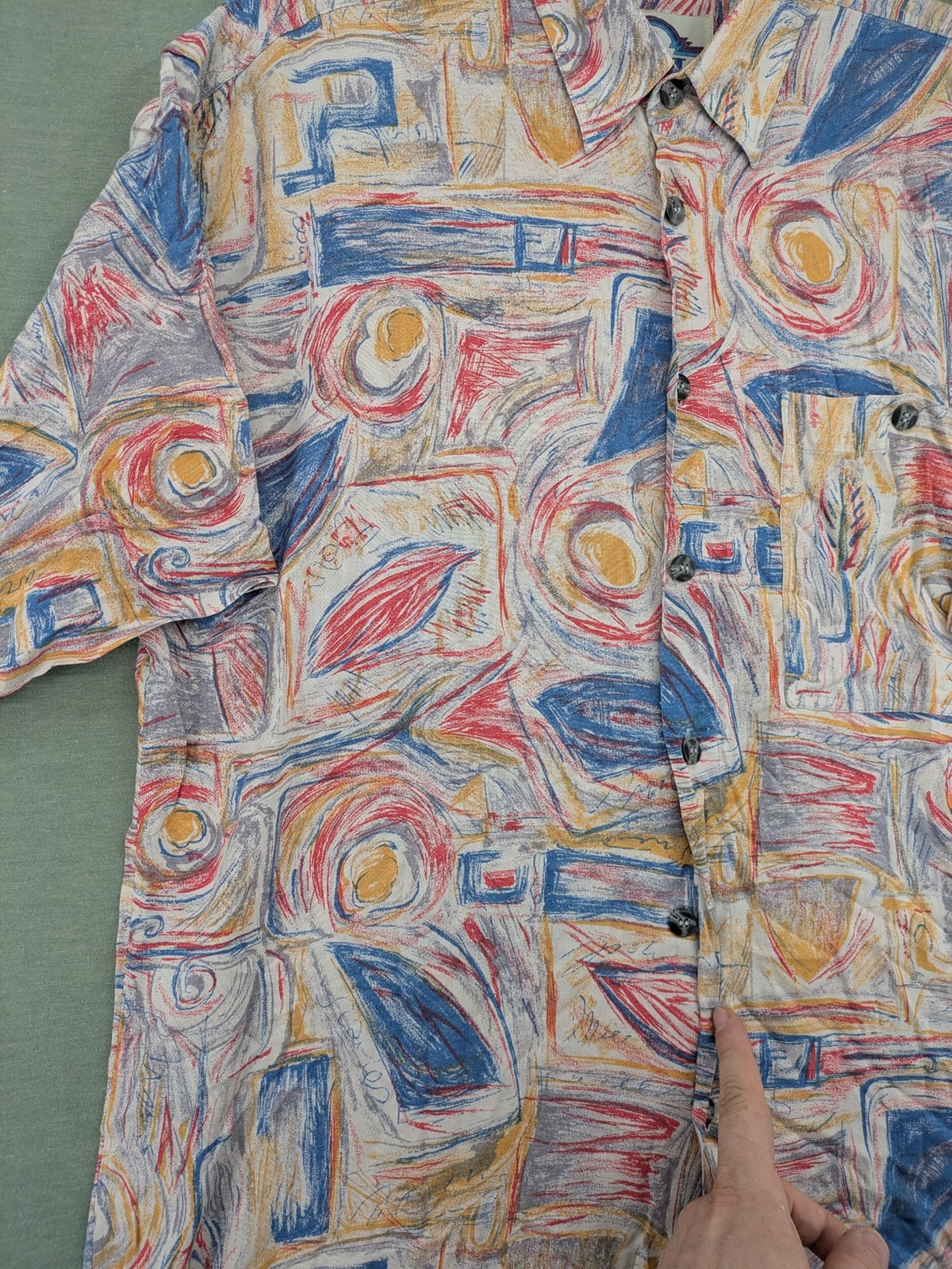 Limit short-sleeve shirt multi-coloured abstract pattern, lightweight viscose, chest pocket detail.
