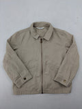 H&M beige twill coat with full zip, classic collar, and practical pockets.