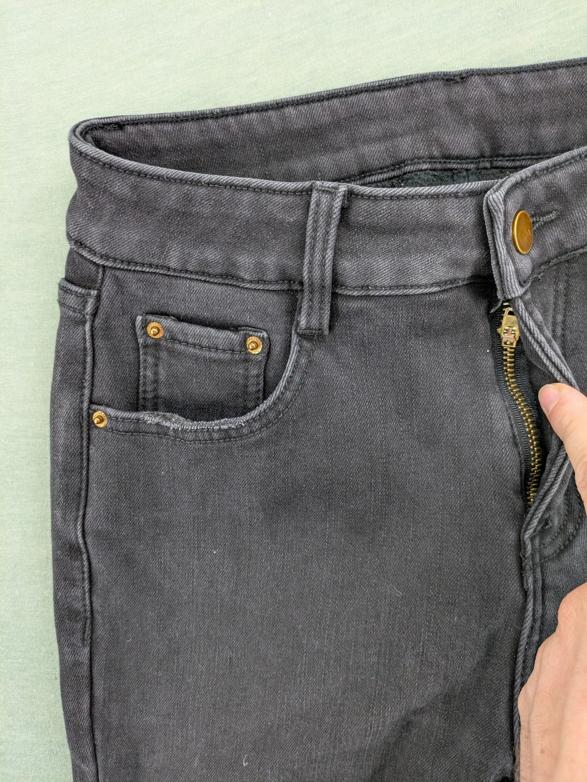 Disney black straight jeans with Minnie Mouse detail, cropped length, stretchy cotton blend.