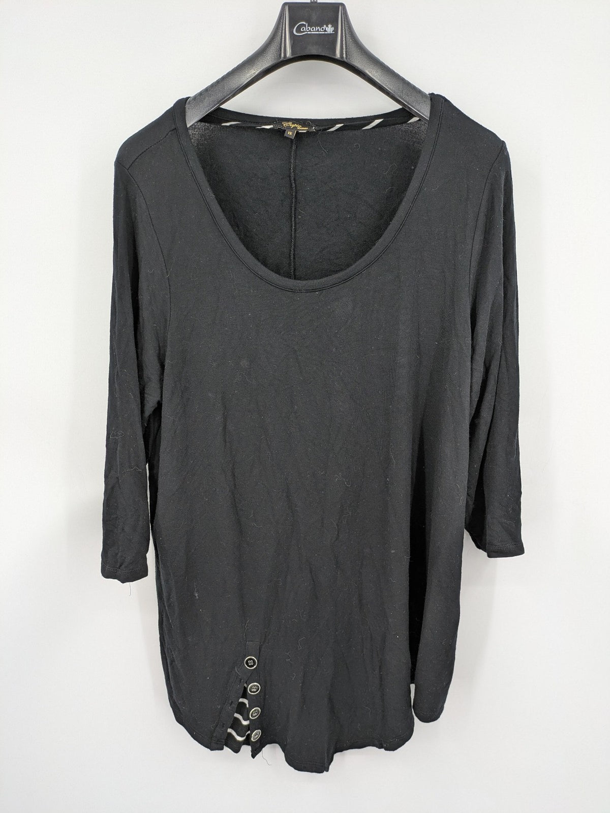 Cupio black long sleeve tunic with side button placket and high-low hem.