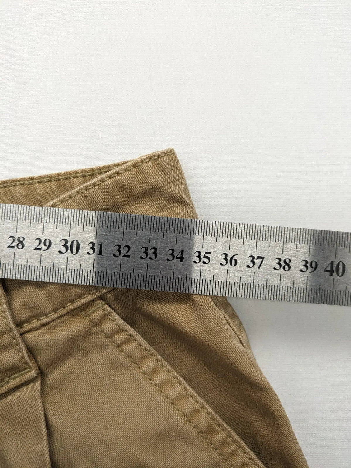 H&M beige tapered leg pants with pleats, high waist, 100% cotton, side pockets.