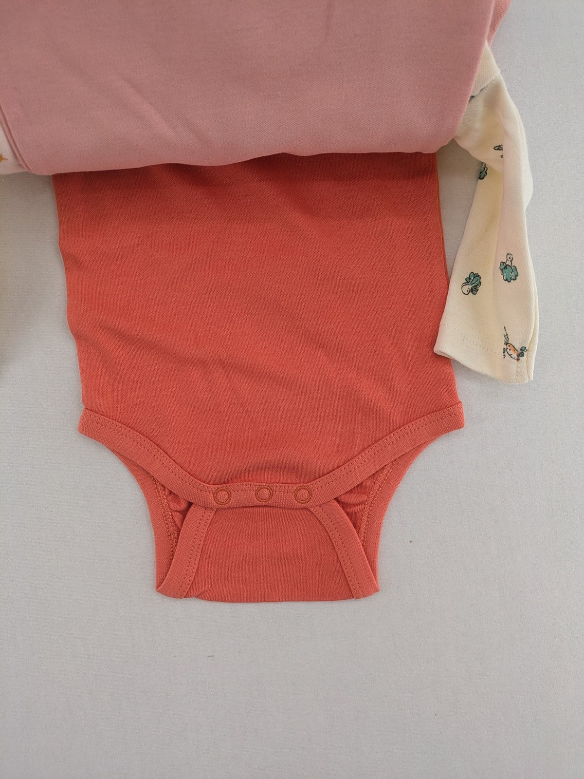 Ergee baby bodysuits set blue cream orange various cute patterns and wrap design.