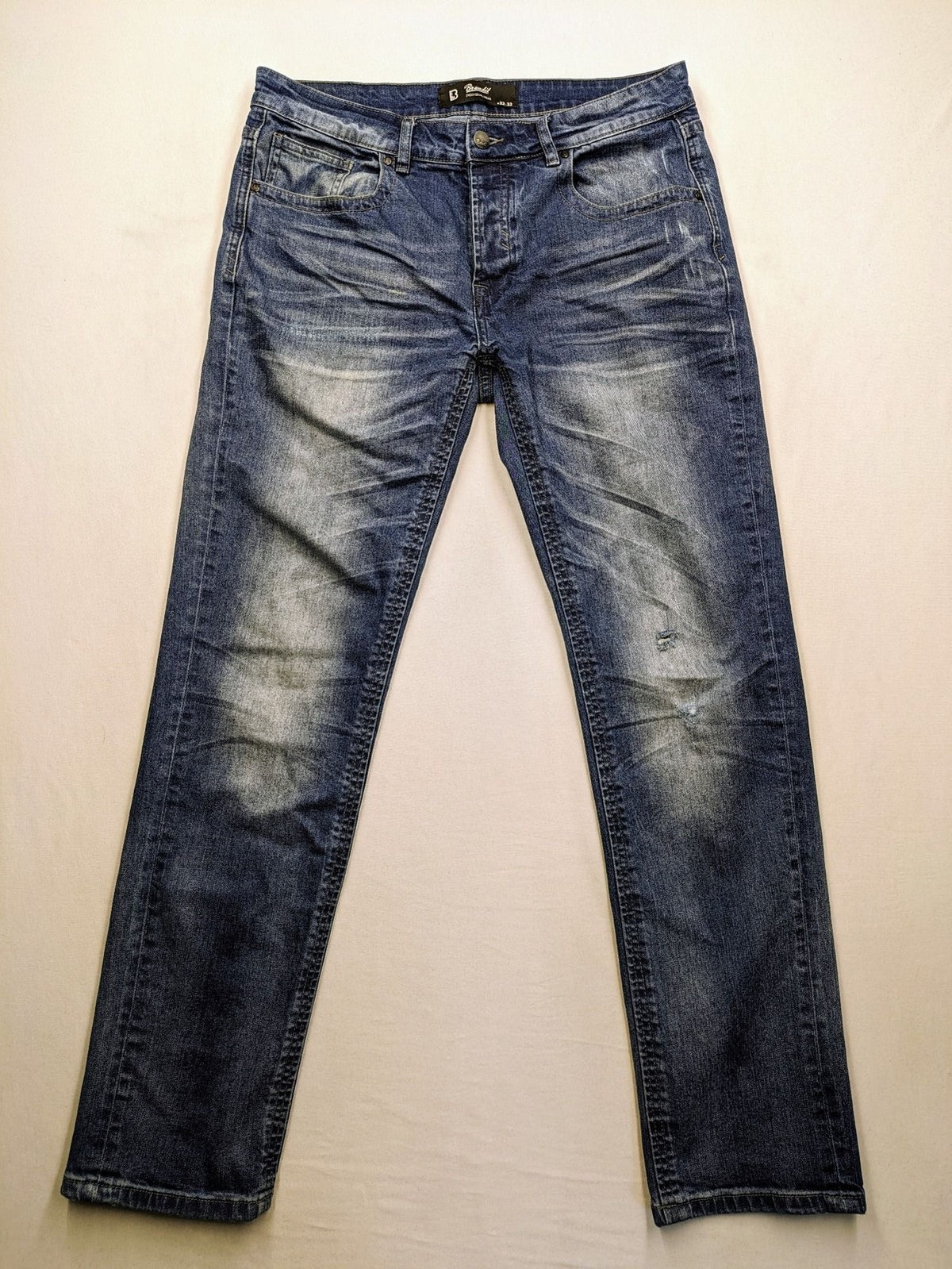Brandit blue straight jeans with distressed details, button fly, and classic 5-pocket style.
