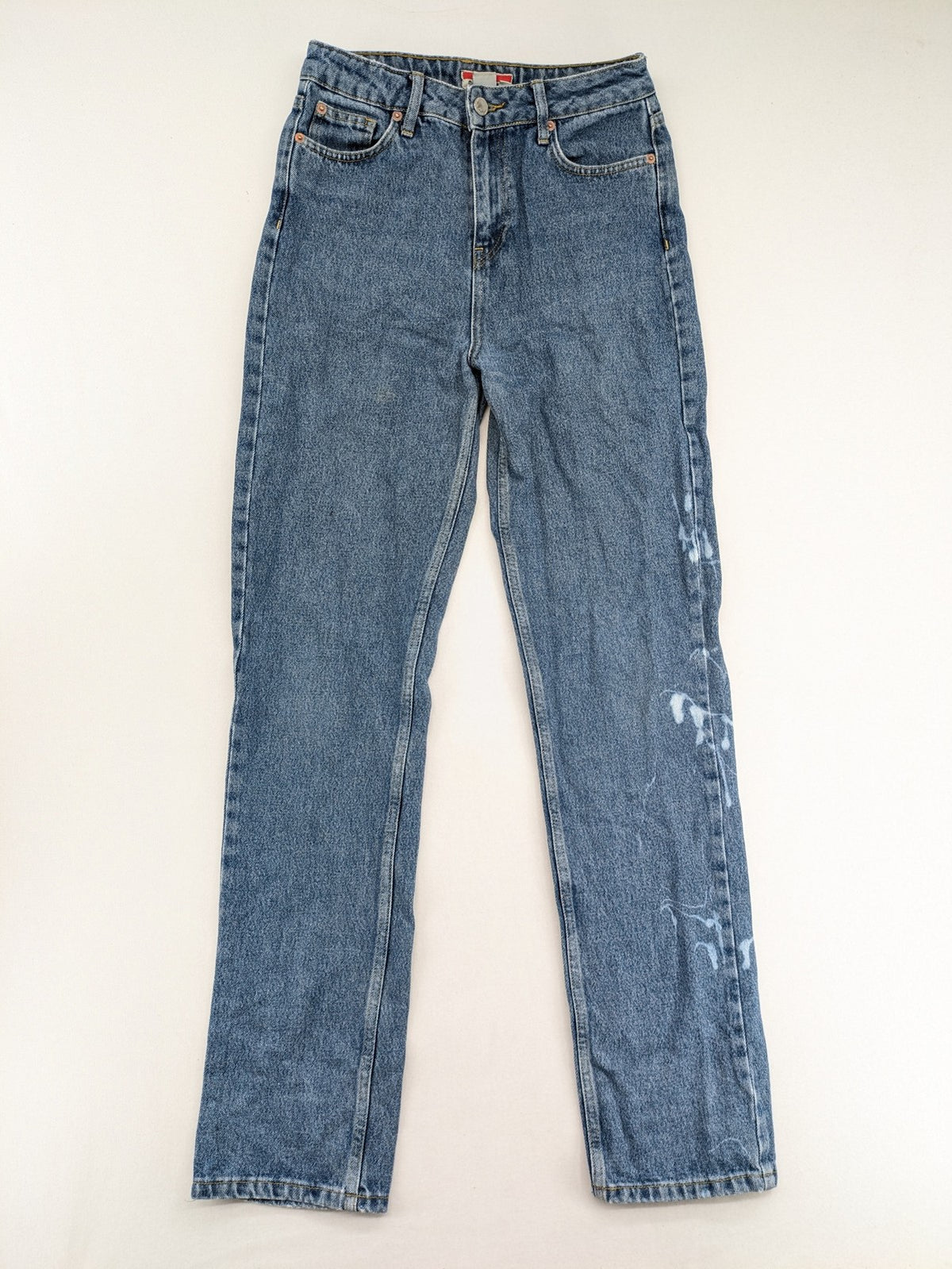 Castro Jeans blue straight leg jeans high waist with white paint splatter details.
