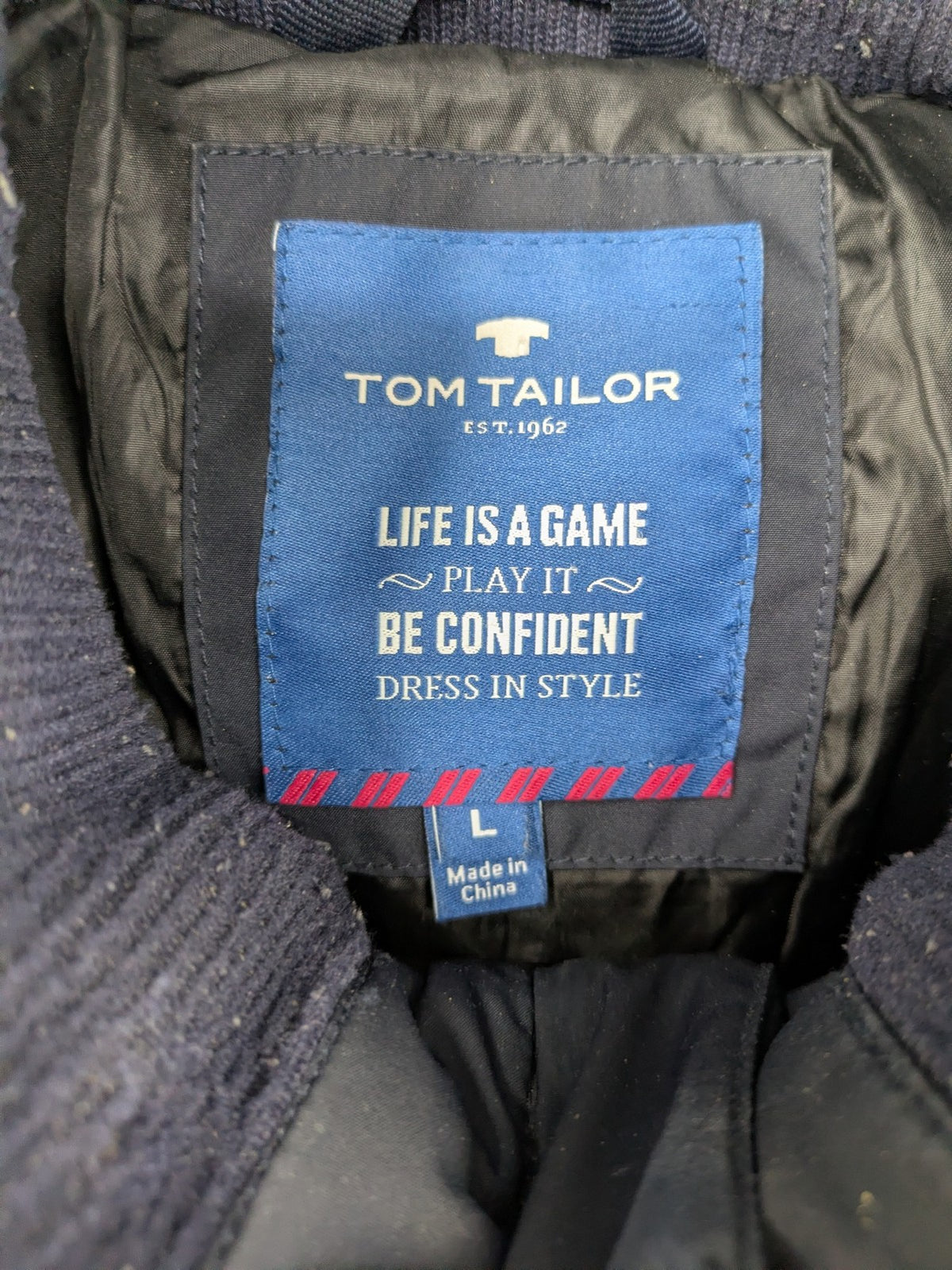 Tom Tailor navy puffer jacket with quilted design and adjustable hood, featuring multiple pockets.
