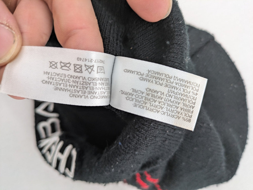 Star Wars black and red reversible beanie featuring Chewbacca graphic and logo.