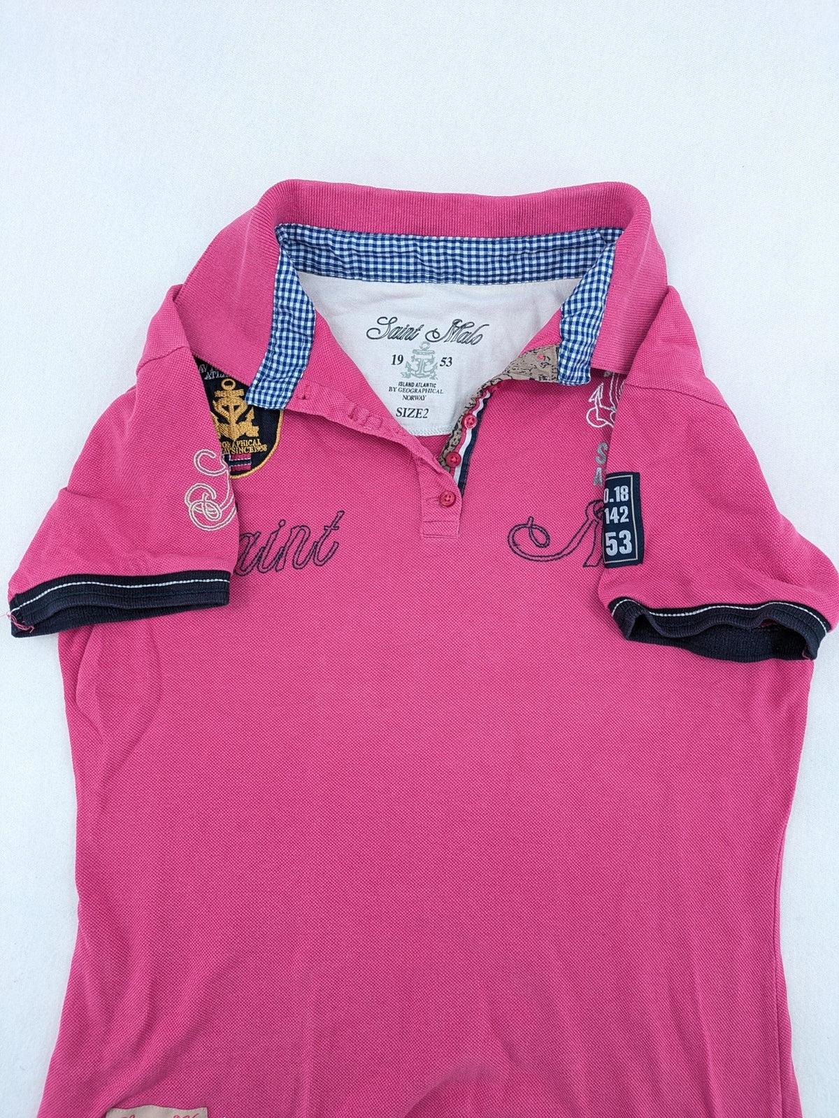 Geographical Norway pink polo shirt with embroidered Saint Malo design and Gingham trim.