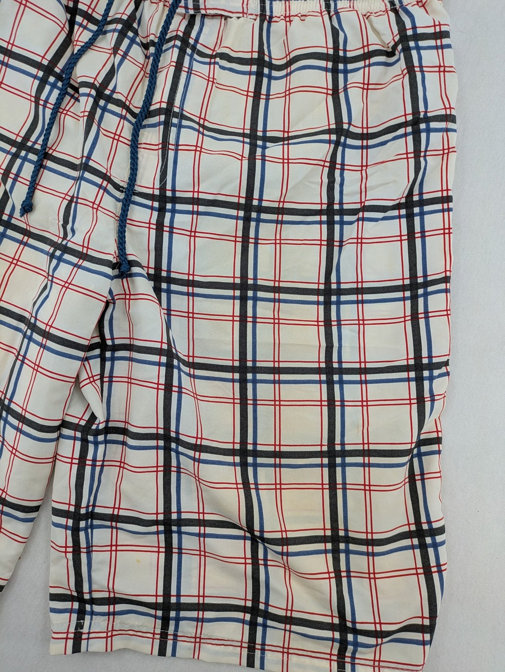 Crivit multi-coloured board shorts with classic check pattern and adjustable drawstring waistband.
