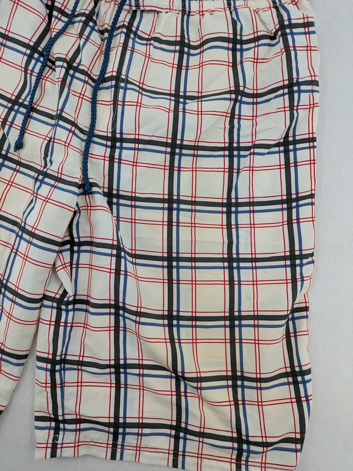 Crivit multi-coloured board shorts with classic check pattern and adjustable drawstring waistband.