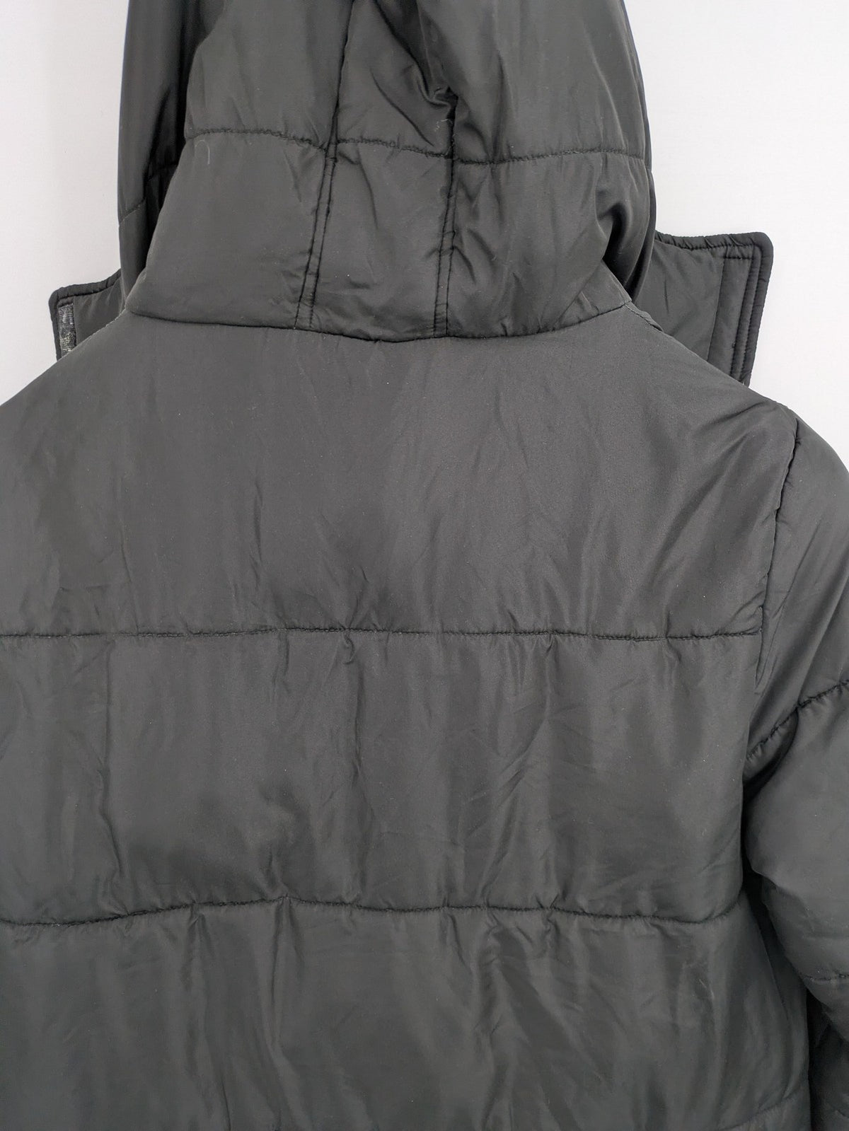 Zeeman grey quilted coat size 38 with hood and side snap buttons.
