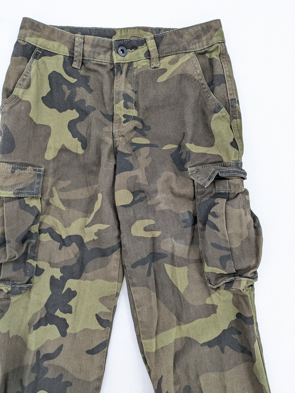 Rainbow camouflage cargo pants in green-brown with jogger silhouette and multiple pockets.