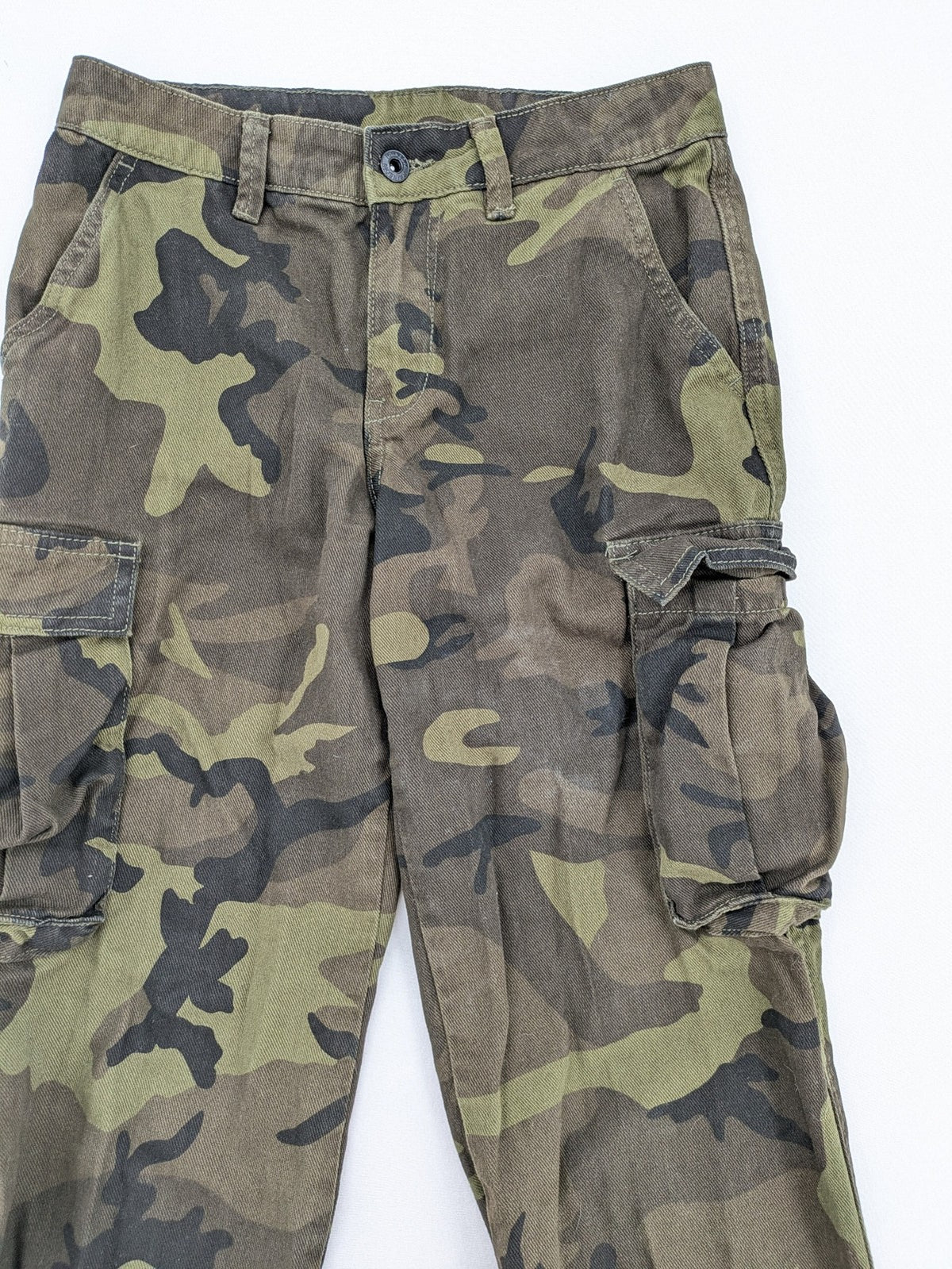 Rainbow camouflage cargo pants in green-brown with jogger silhouette and multiple pockets.