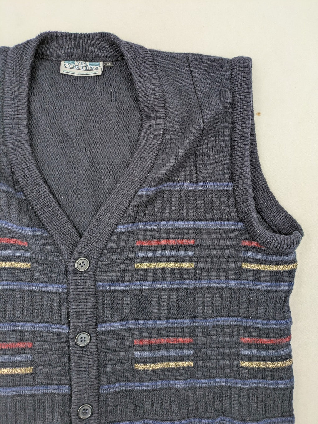 Via Cortesa gold turtle neck jumper with structured pattern and V-neck design.