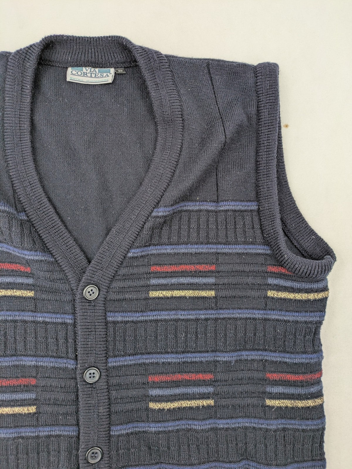 Via Cortesa gold turtle neck jumper with structured pattern and V-neck design.