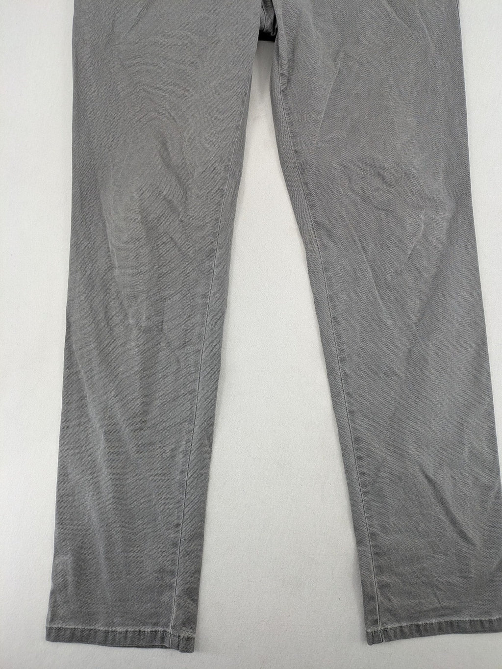MMX grey chino pants with patterned interior lining and contrasting waistband, made from organic cotton.