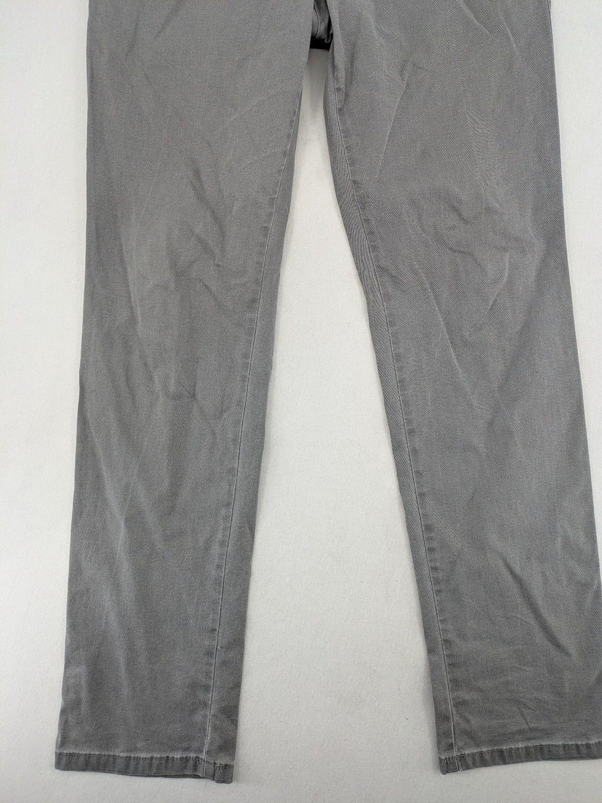 MMX grey chino pants with patterned interior lining and contrasting waistband, made from organic cotton.