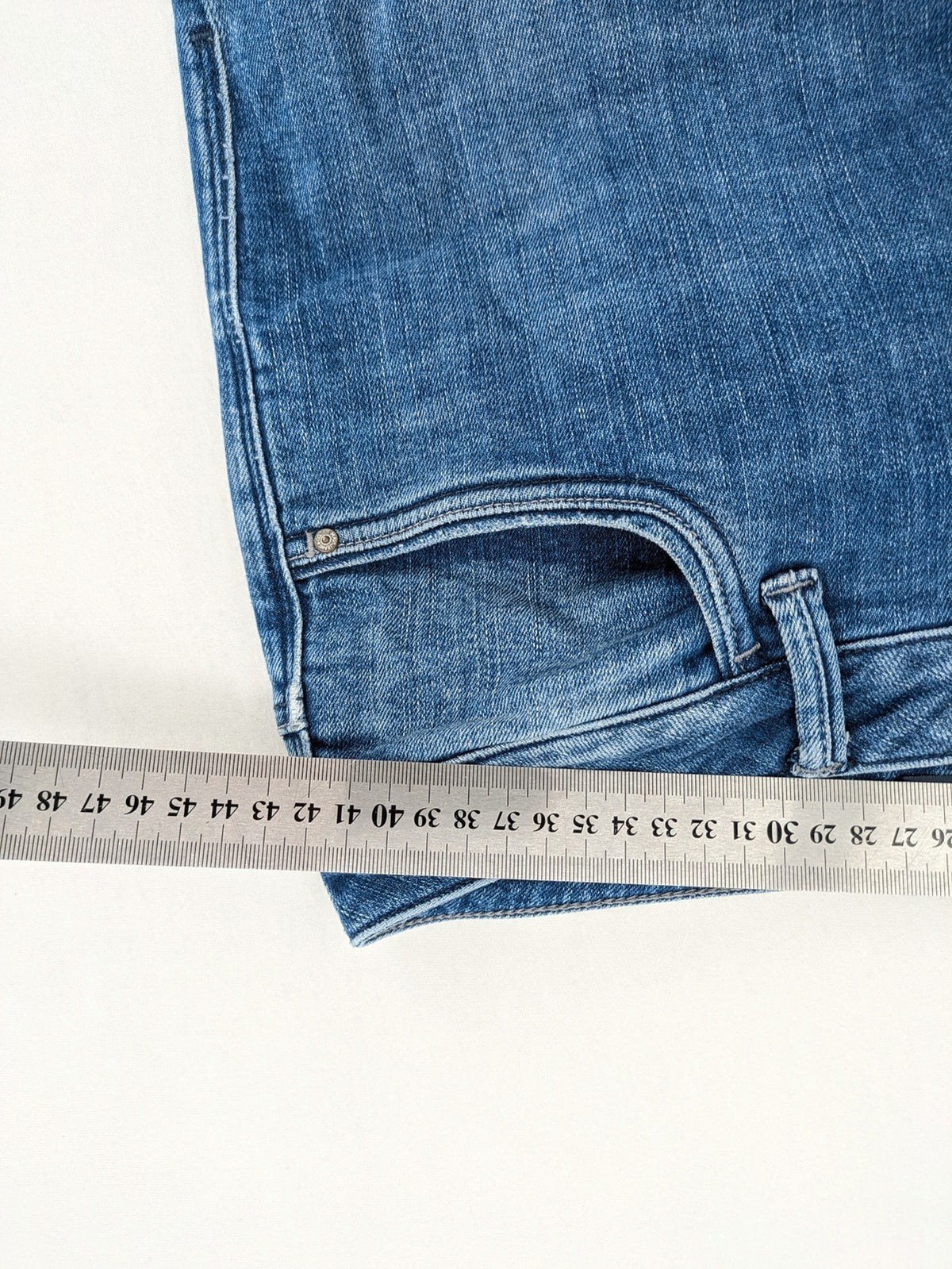 Mavi blue straight leg jeans with classic 5-pocket styling and medium wash.