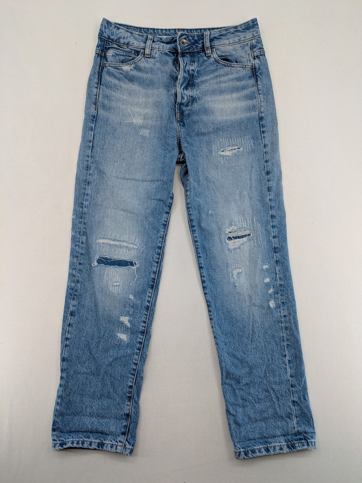 G-Star Raw blue distressed high boyfriend jeans with ripped details and classic button closure.