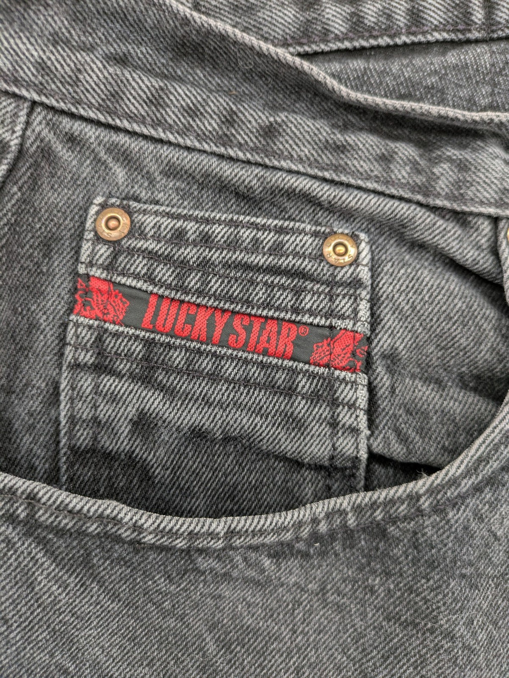 Lucky Star grey tapered high waist jeans with faded wash and red logo details.