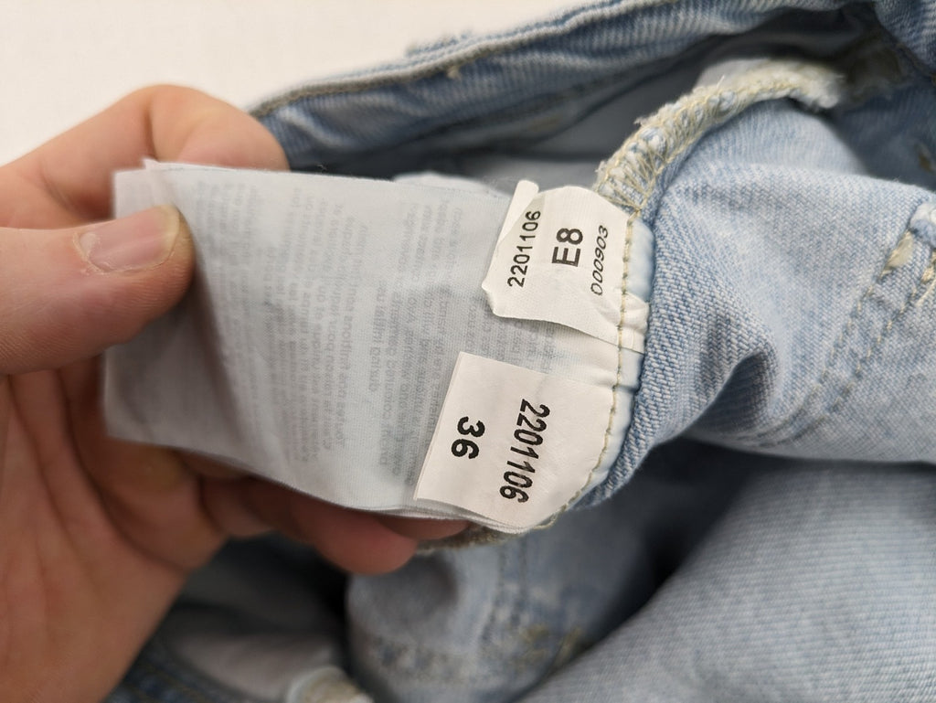 MNG blue straight jeans with cargo pockets and raw hem, high waist denim.
