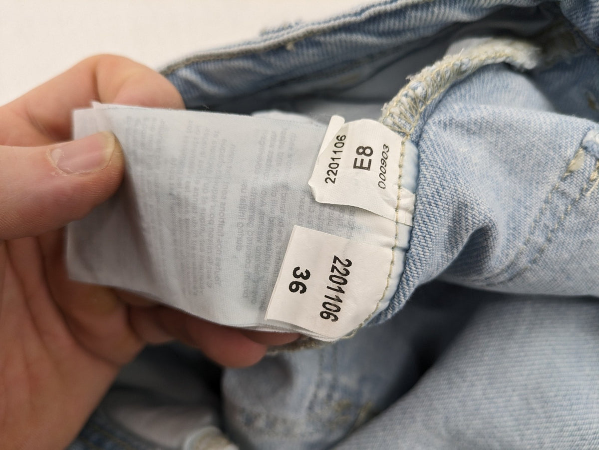 MNG blue straight jeans with cargo pockets and raw hem, high waist denim.