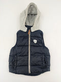 H&M navy puffer vest with grey hood and zip pockets for kids.