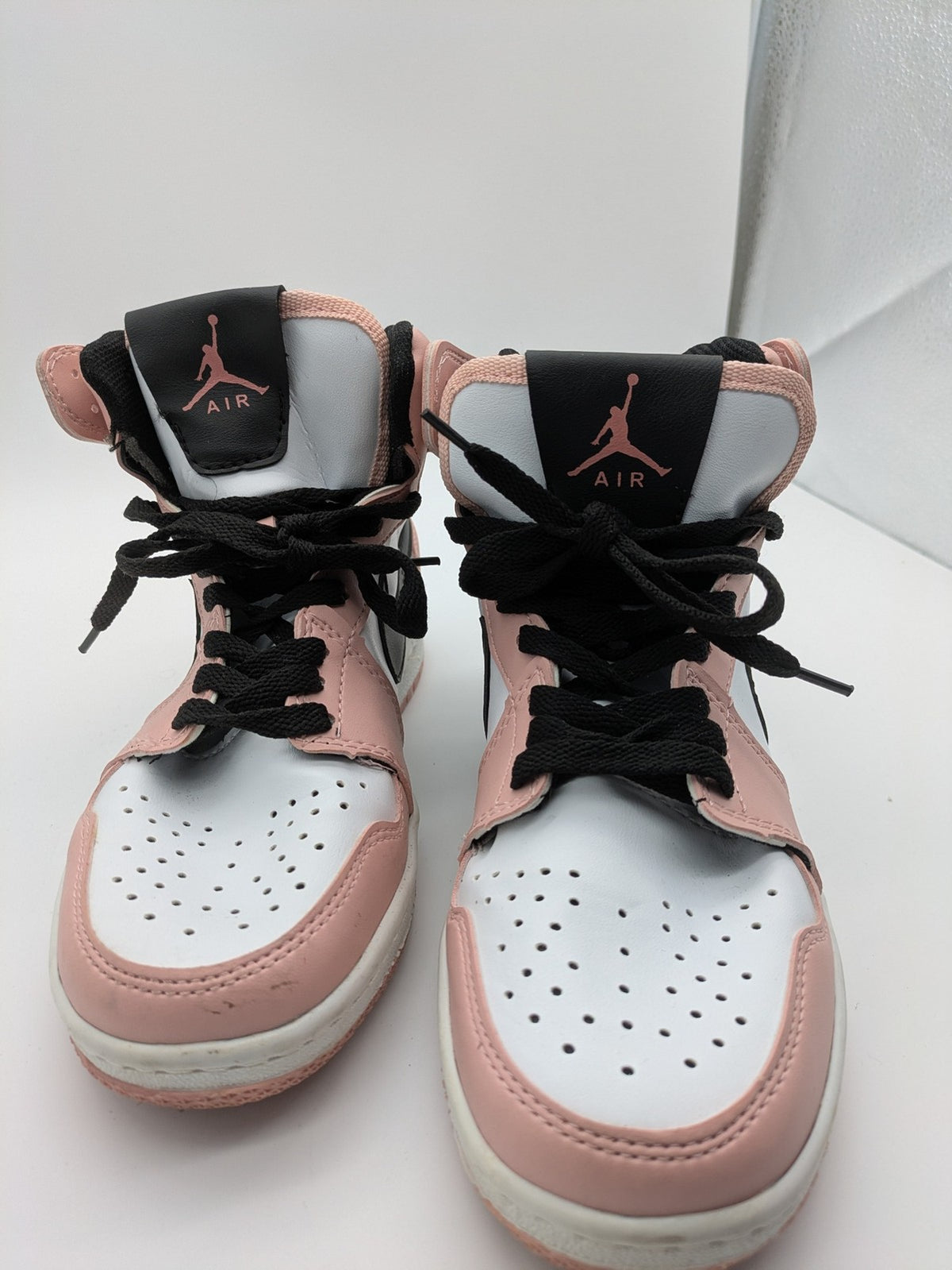 Nike Air Jordan high-top sneakers multi with Wings logo, Jumpman detail, and perforated toe.