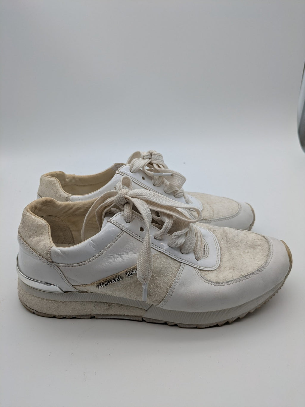 Michael Kors multi sneaker white leather and cream textile with silver logo details.