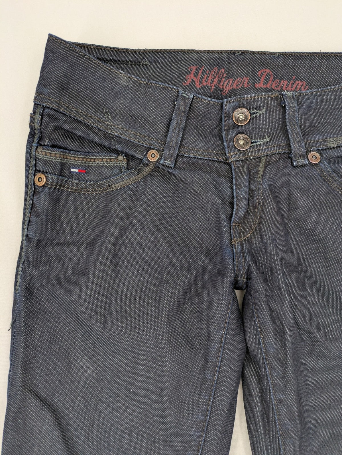 Hilfiger Denim blue straight jeans with double button closure and logo detail.