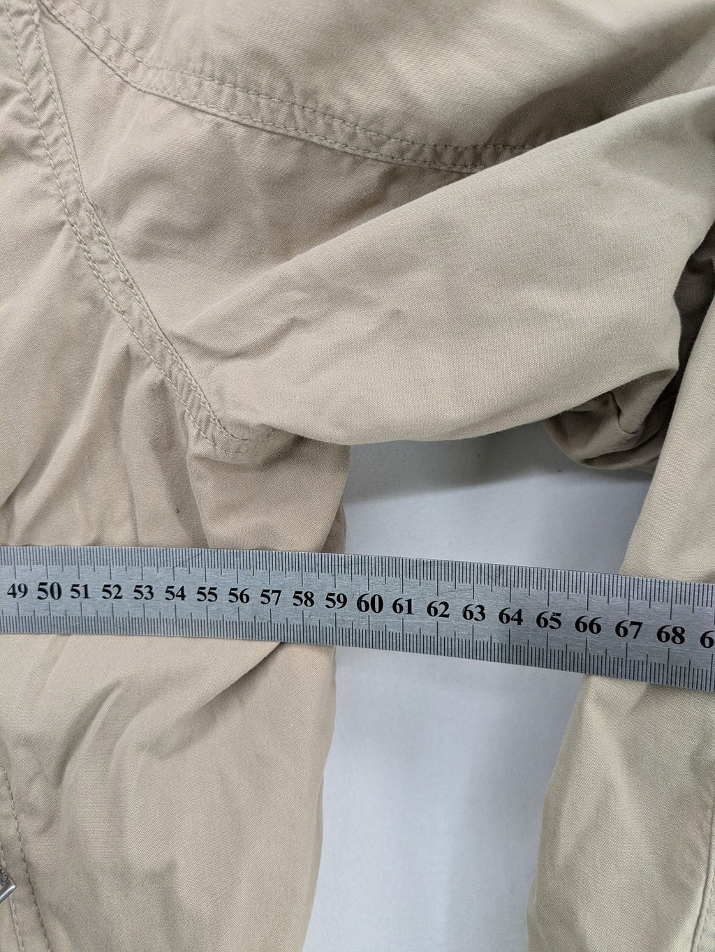 Canda beige bomber jacket full zip with ribbed collar and buttoned chest pockets.
