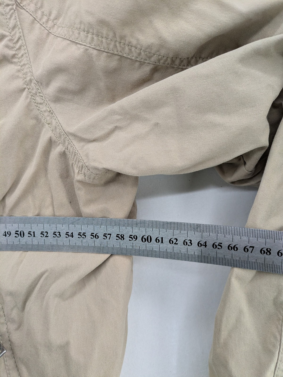 Canda beige bomber jacket full zip with ribbed collar and buttoned chest pockets.