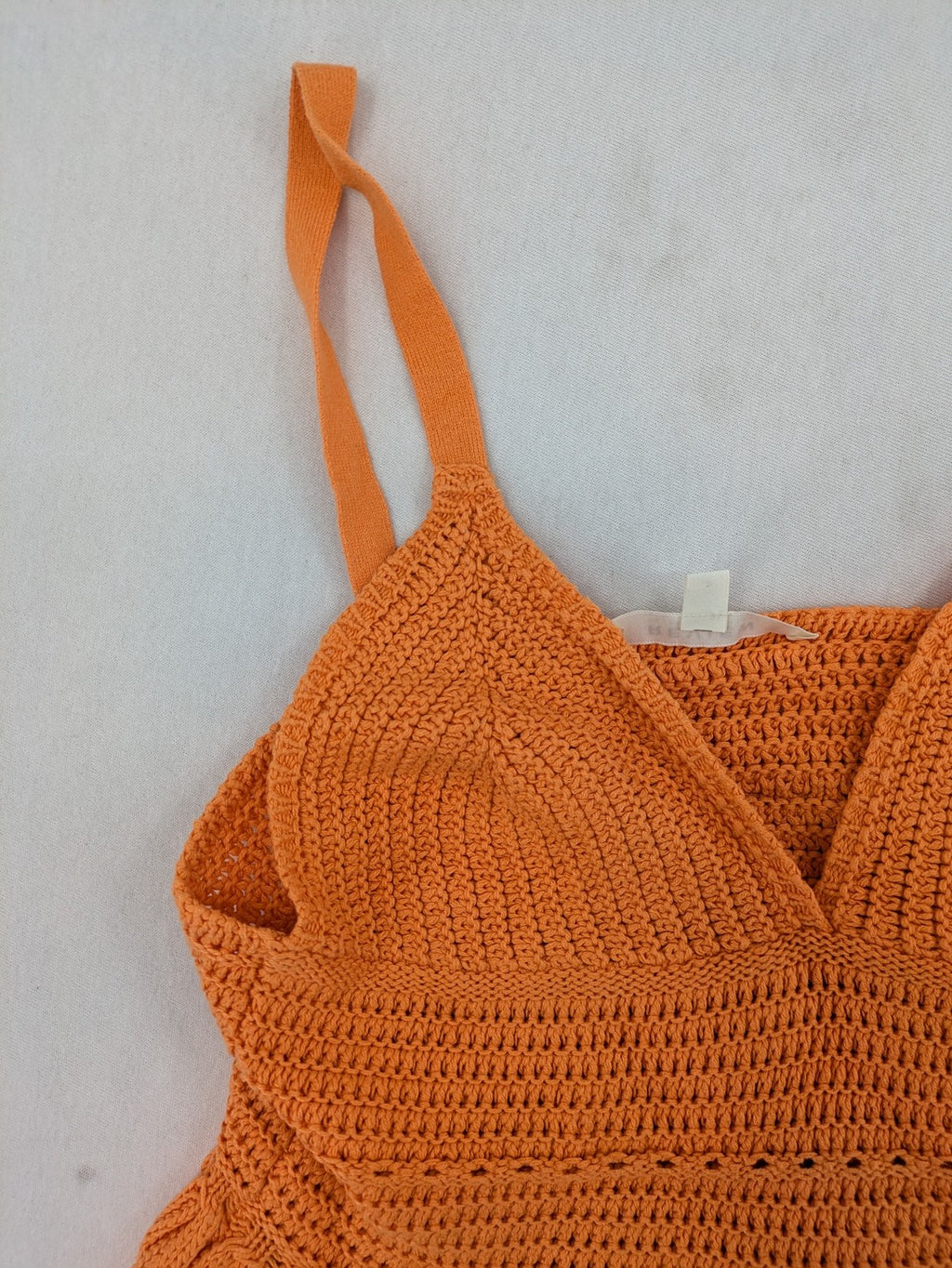 REVIEW orange crochet top with V-neck and peplum hem, made from 100% cotton.