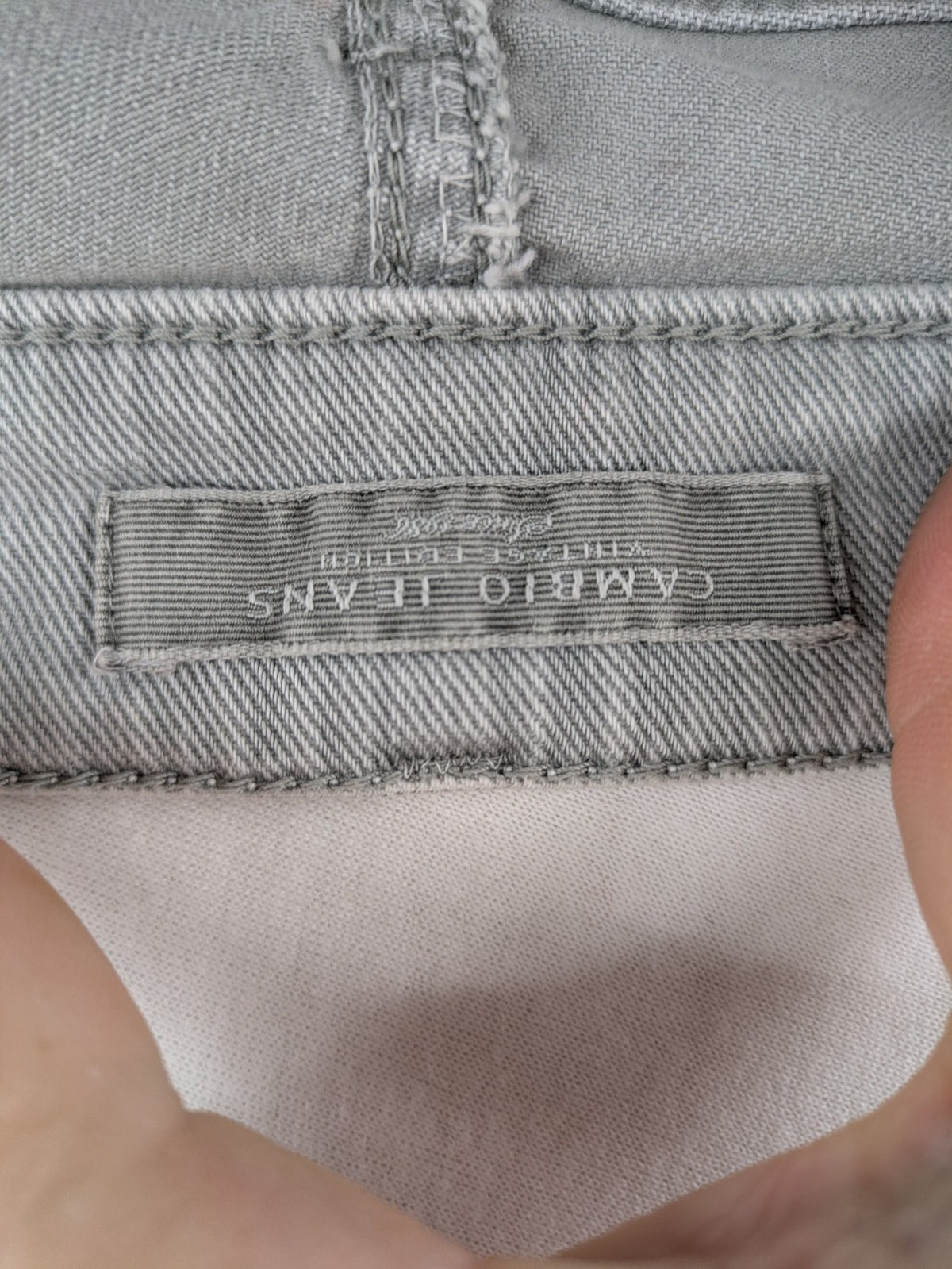 Cambio grey straight leg jeans with five-pocket design and logo button closure.