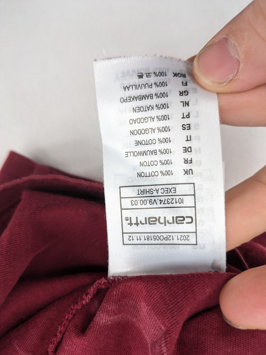 Carhartt burgundy tank top 100% cotton with iconic logo patch at hem.
