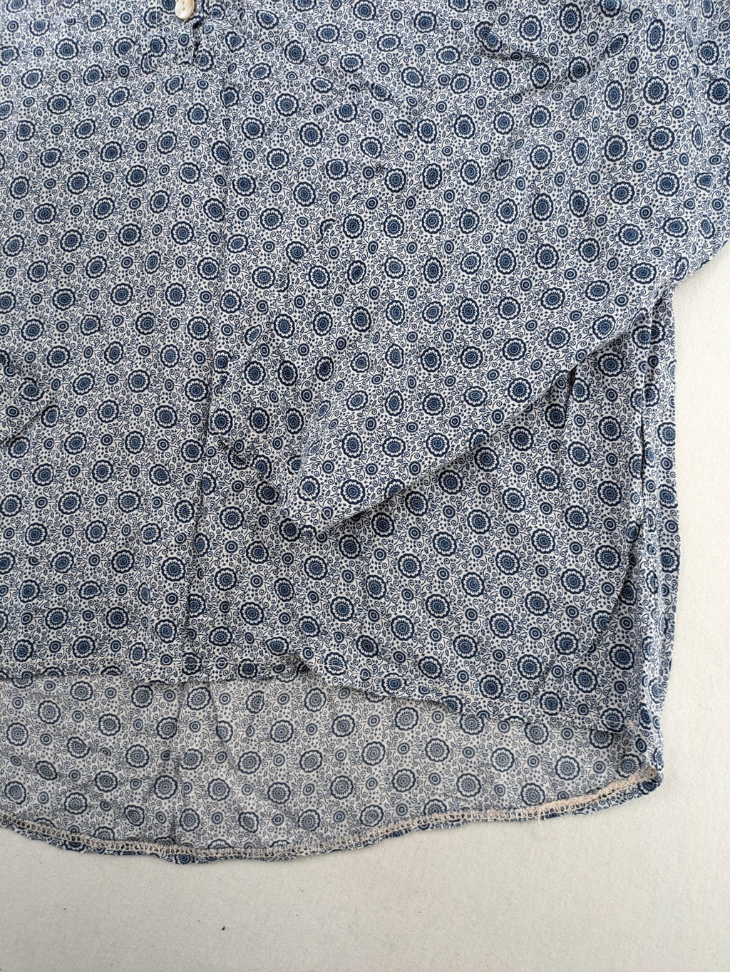 M/L blue and grey tunic top with geometric pattern and stand-up collar.