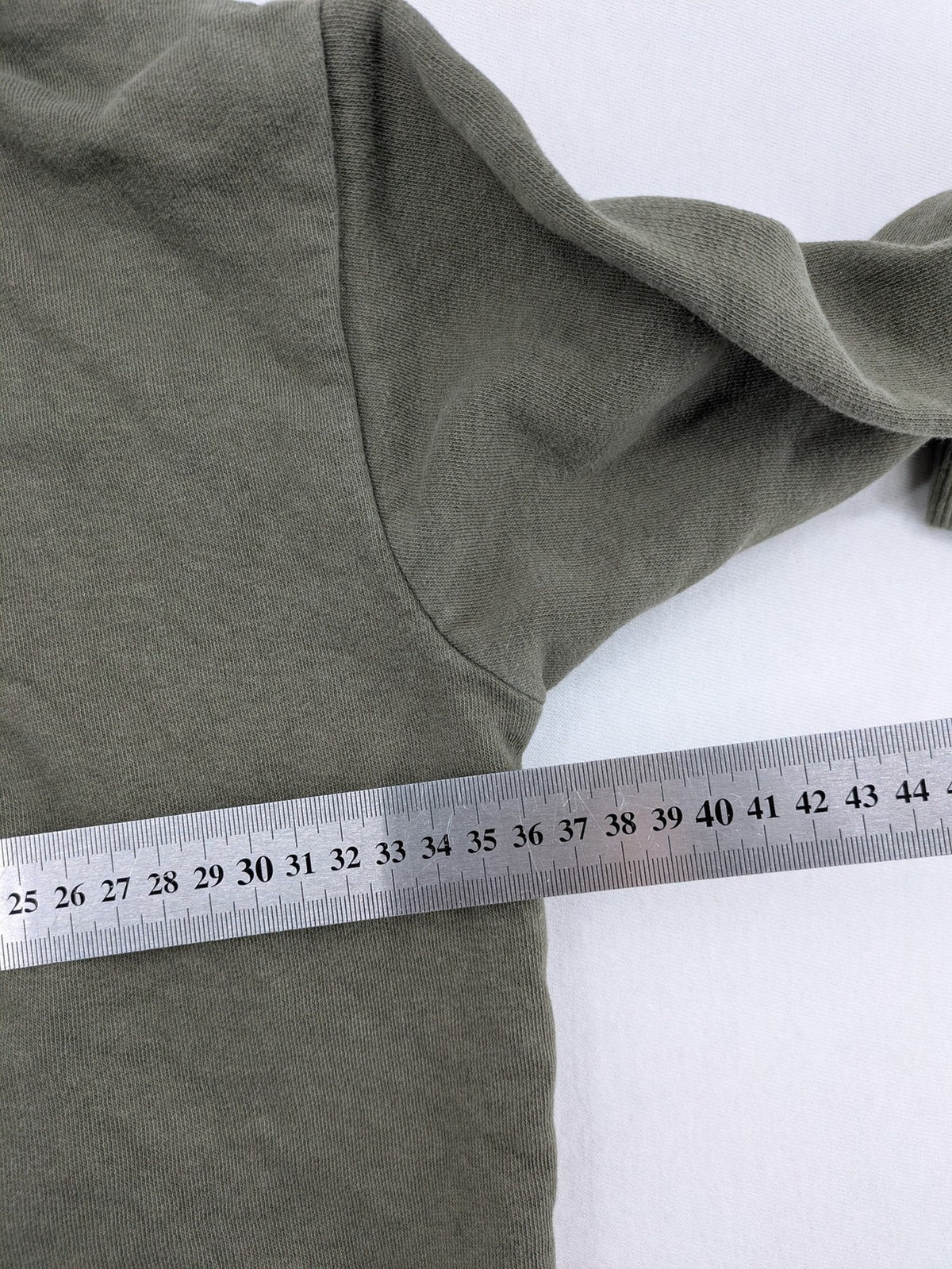 Fila turtle neck jumper khaki with large white logo and kangaroo pocket.