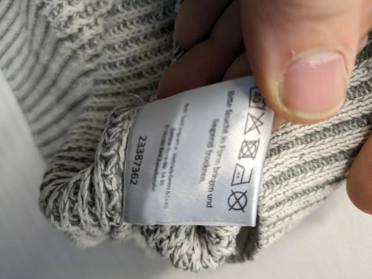 Autumn Glow grey turtle neck jumper with ribbed pattern and button detail.