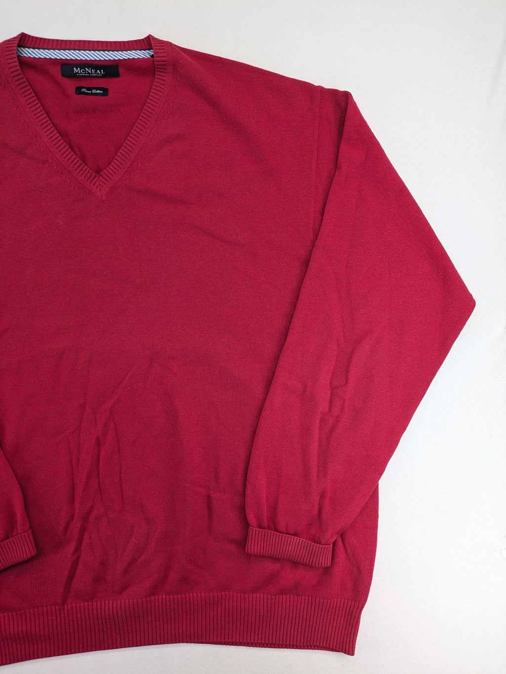 McNeal red turtle neck jumper V-neck design with ribbed cuffs and hem.