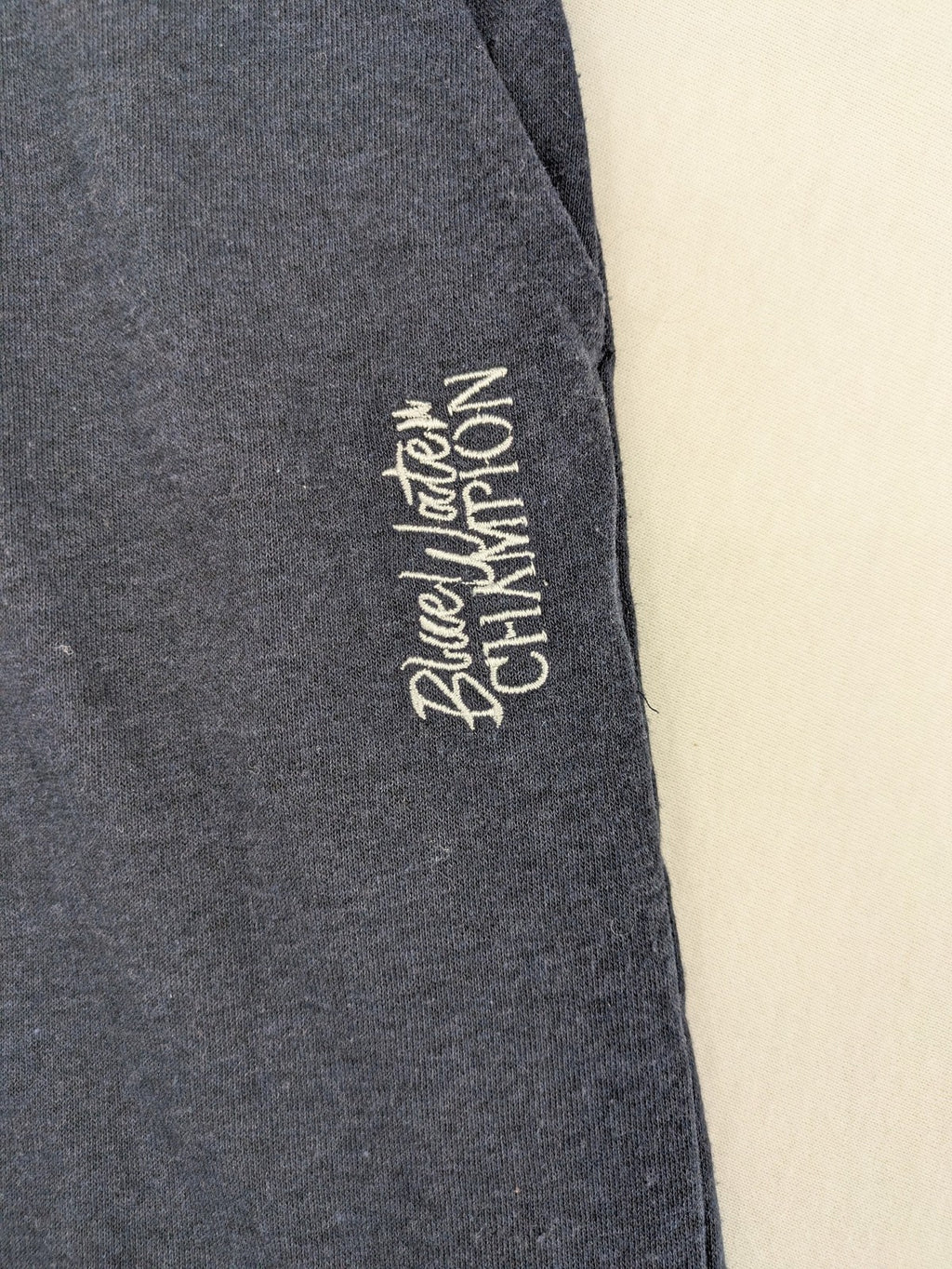 Livergy blue sweatshorts with embroidered "Blue Water Champion" logo and adjustable drawstring.